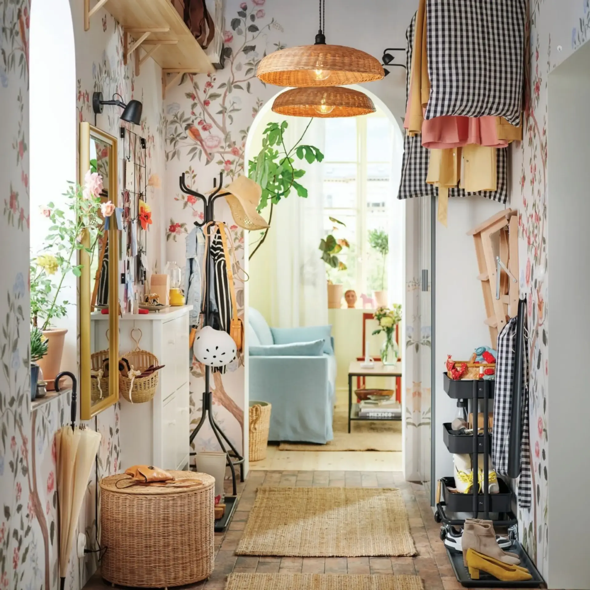 Hallway with floral wallpaper opening onto a living room